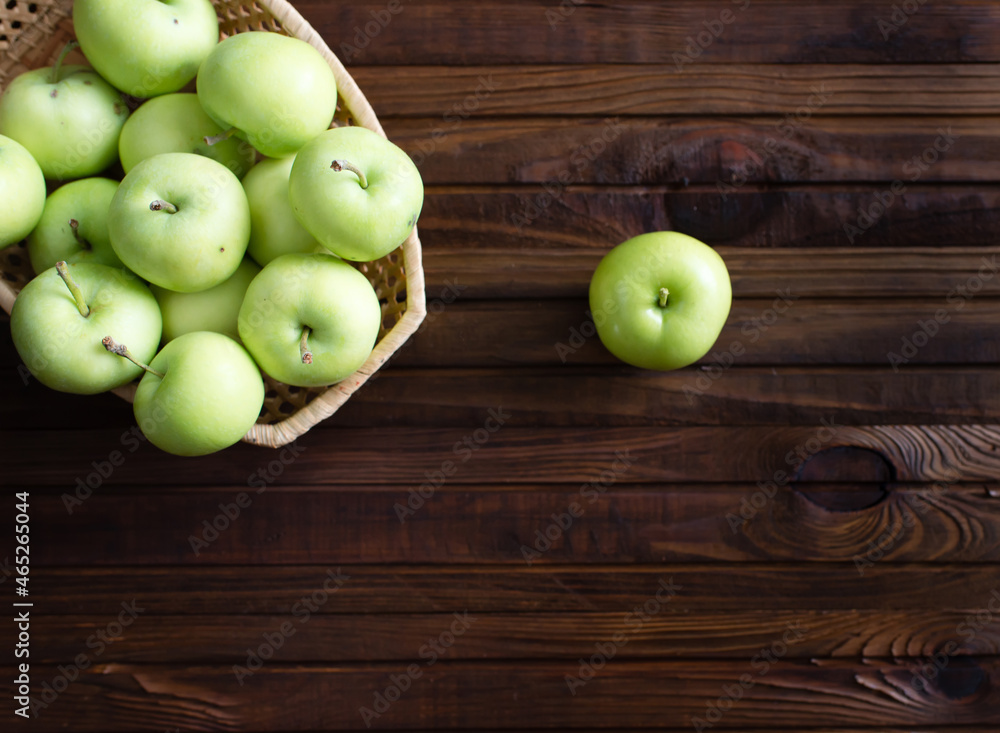 Lots of ripe green apples on a wooden background. Lots of ripe green apples on a wooden background.