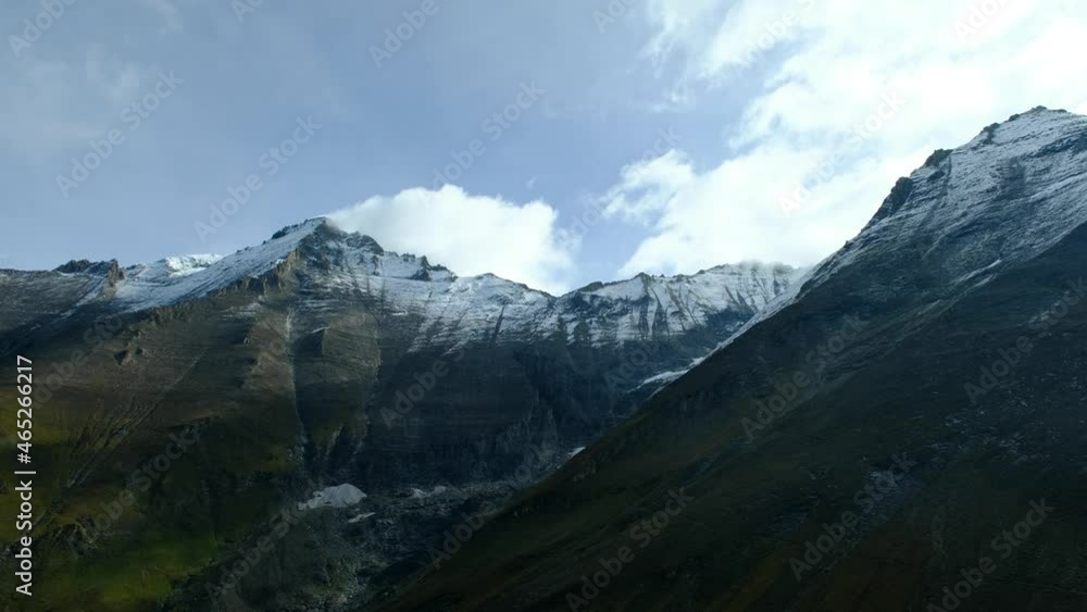 Fast motion of clouds and fog, moving with the wind on the snow covered mountain top at autumn, a 4K video clip, Höhenburg Stauseen, Austria. Fast motion of clouds and fog, moving with the wind on the snow covered mountain top at autumn, a 4K video clip, Höhenburg Stauseen, Austria.