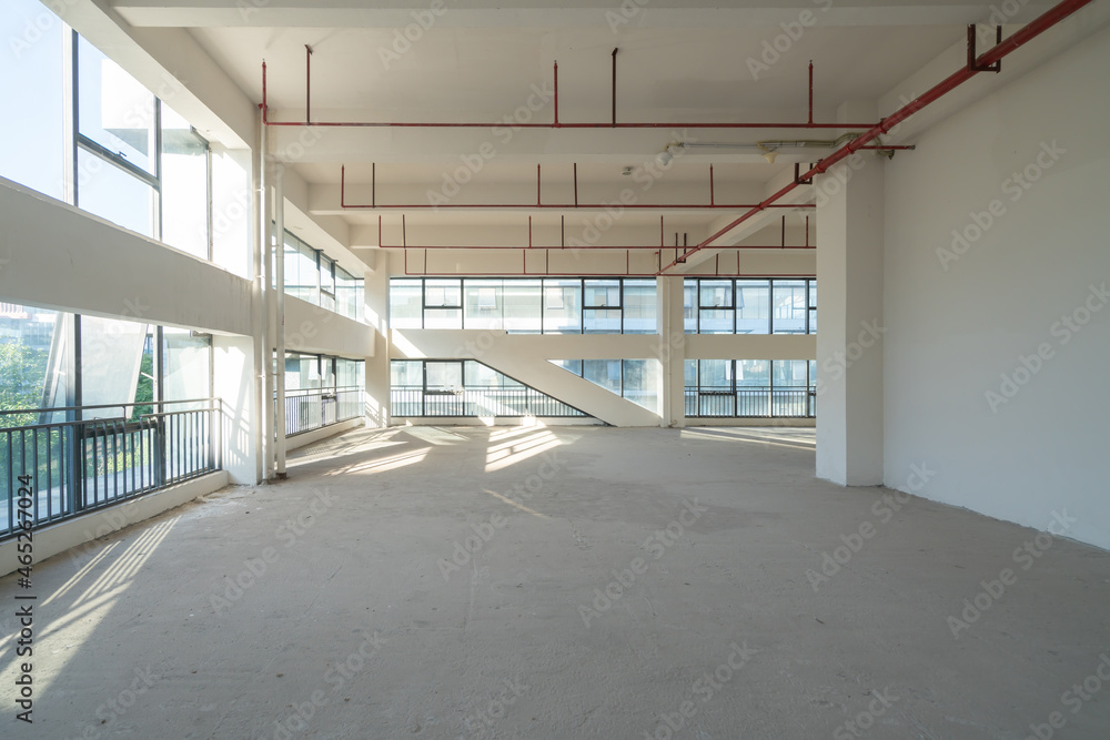 Undecorated interior space of office building - obrazy, fototapety, plakaty 