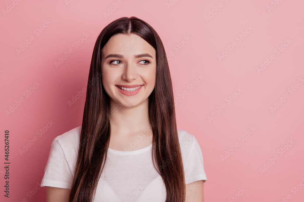 Portrait of satisfied girl happy positive smile look empty space isolated over shine color background Portrait of satisfied girl happy positive smile look empty space isolated over shine color background