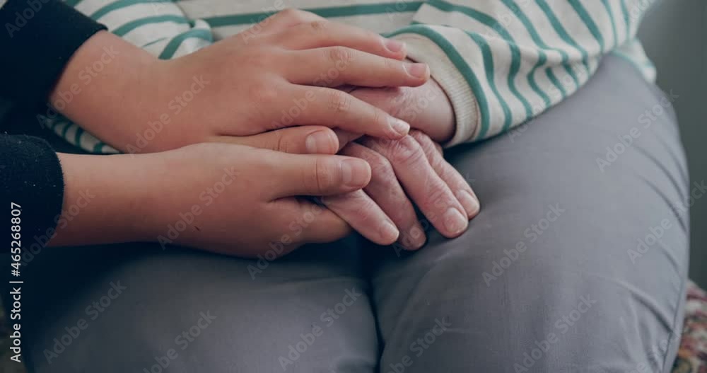 Children's hands take the hands of the grandmother. A symbol of love and tenderness between generations Children's hands take the hands of the grandmother. A symbol of love and tenderness between generations