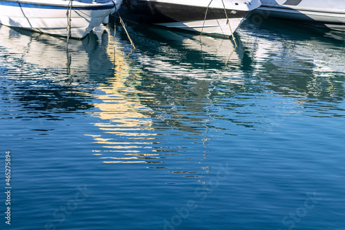 Boat reflections in water 