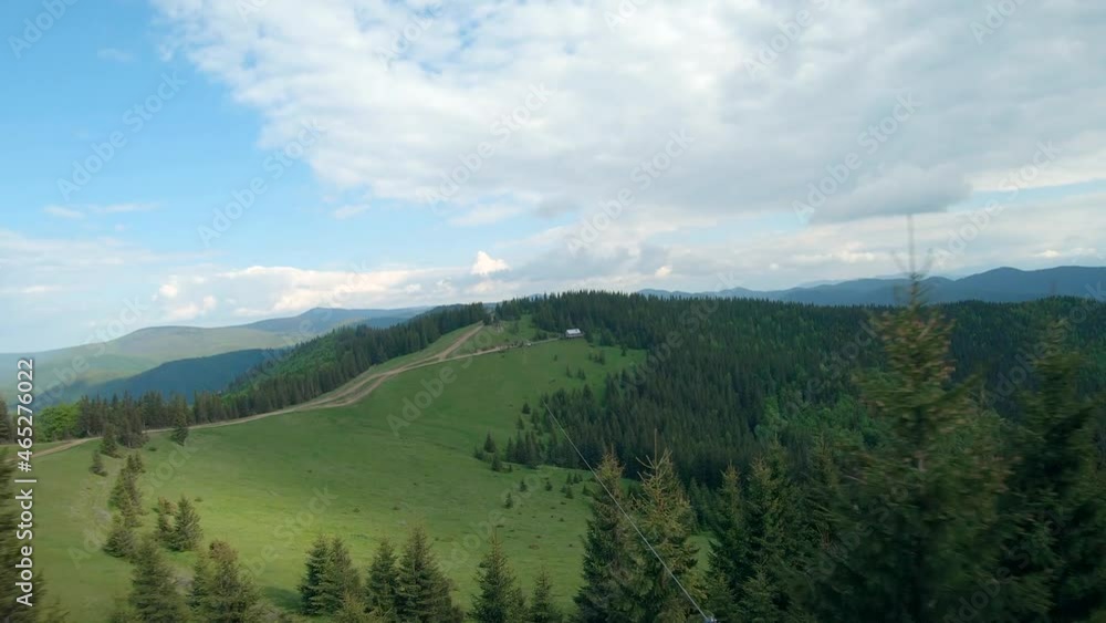 Unusual view of a woman riding a zipline among the mountains. Fast and maneuverable flight around a person. Filmed on FPV drone. Unusual view of a woman riding a zipline among the mountains. Fast and maneuverable flight around a person. Filmed on FPV drone.