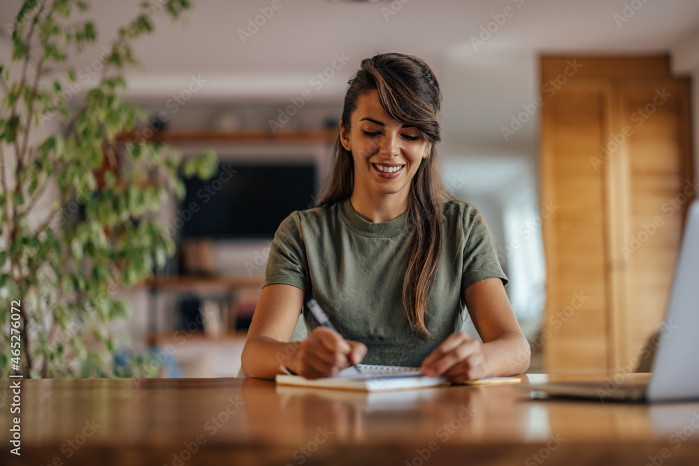 Adult woman, writing down her thoughts. Adult woman, writing down her thoughts.