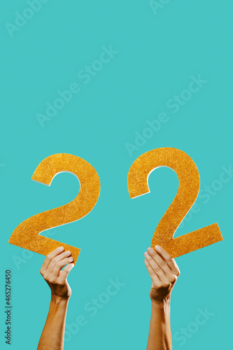 man with the number 22 in his hands photo
