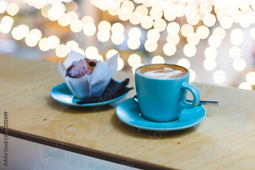 Latte art with cake with background bokeh for holidays. 