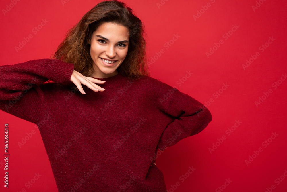 Photo shot of pretty joyful smiling young female person wearing casual trendy outfit standing isolated on colourful background with copy space looking at camera and having fun Photo shot of pretty joyful smiling young female person wearing casual trendy outfit standing isolated on colourful background with copy space looking at camera and having fun