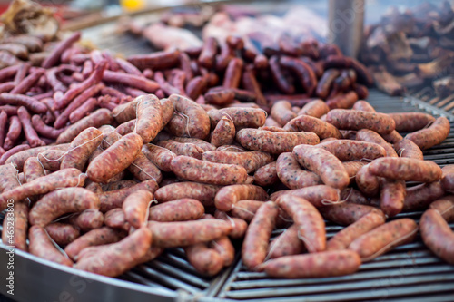 Grilled sausages in the process of cooking outdoor