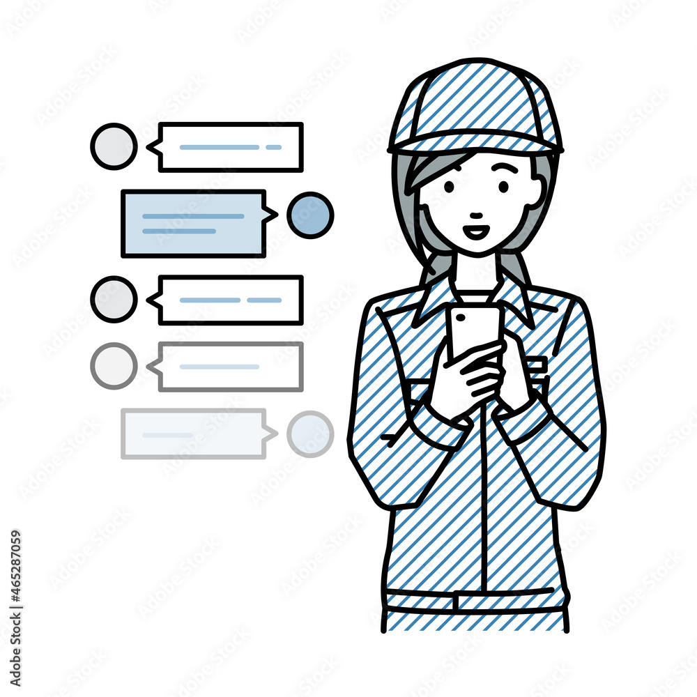 立ってスマートフォンで楽しくチャットで会話する作業員の女性 立ってスマートフォンで楽しくチャットで会話する作業員の女性