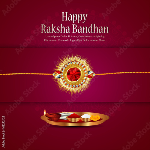 Happy raksha bandhan celebration greeting card with golden rakhi and puja thali