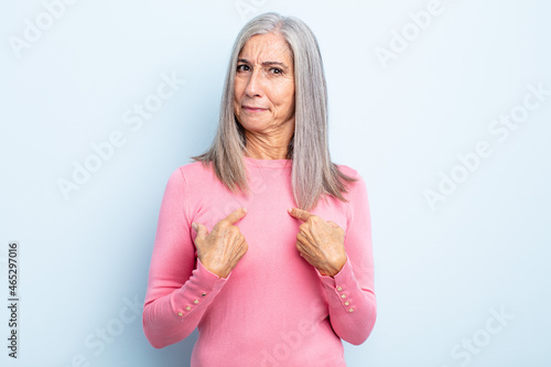 Bilde på lerret middle age gray hair woman pointing to self with a confused and quizzical look,