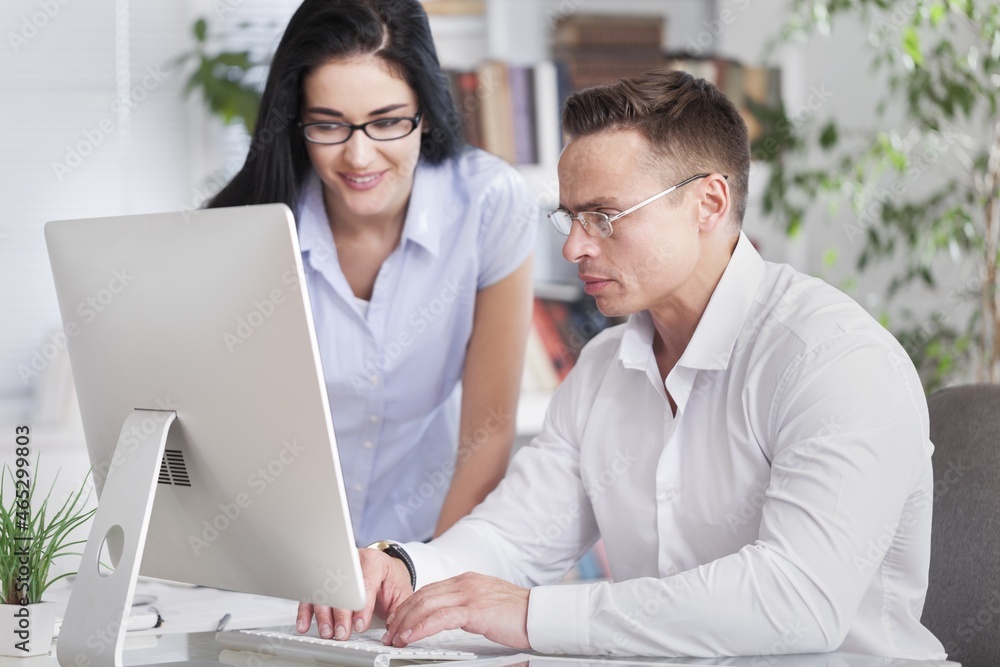 Two professional business people working in office Two professional business people working in office
