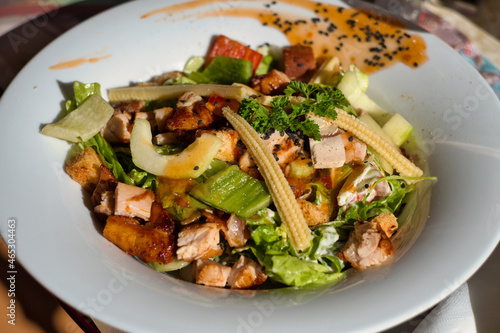 Asian hot Szechuan salad with pickled chicken breast, baby corn, green apple, sweet pepper, iceberg salad and crispy croutons