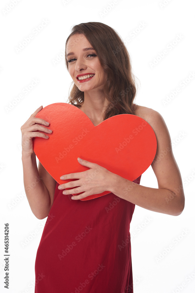 Portrait of cheerful young Caucasian woman with red lips hugging heart while finding her valentine Portrait of cheerful young Caucasian woman with red lips hugging heart while finding her valentine