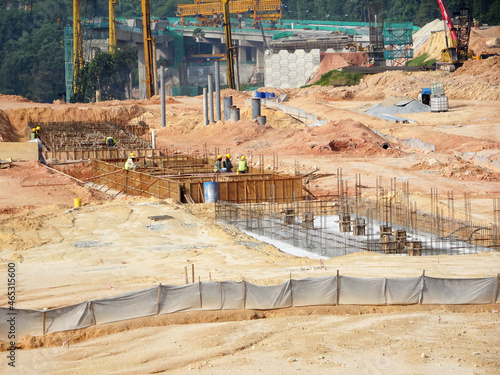 KUALA LUMPUR, MALAYSIA -MARCH 29, 2021: Building ground beam under construction at the site using timber plywood as the formwork. The concrete was reinforced by the steel reinforcement bar 