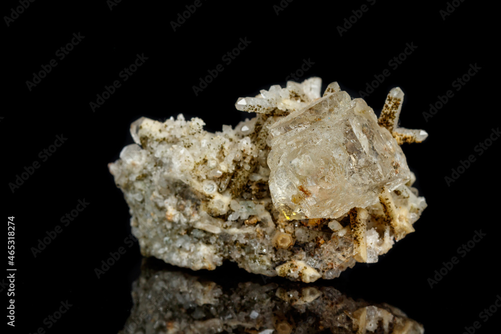 Macro mineral stone fluorite with quartz against black background Macro mineral stone fluorite with quartz against black background