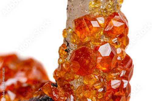 Φωτογραφία macro mineral stone Spessartine, orange, red garnet with quartz on white backgro