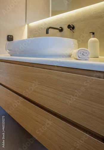 Bathroom sink basin and faucet modern interior design. Black taps and white washbasin 