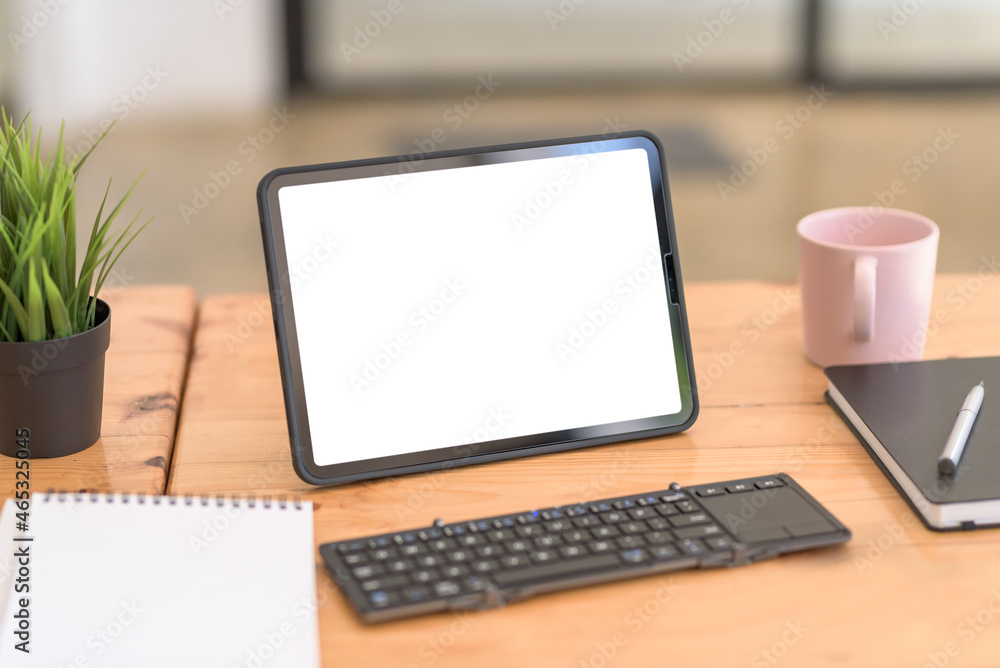 Tablet blank white screen of placed on table office . Mock up. Tablet blank white screen of placed on table office . Mock up.