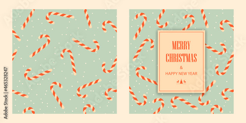 Postcard Merry Christmas and Happy New Year. Red candy canes on a green background. 