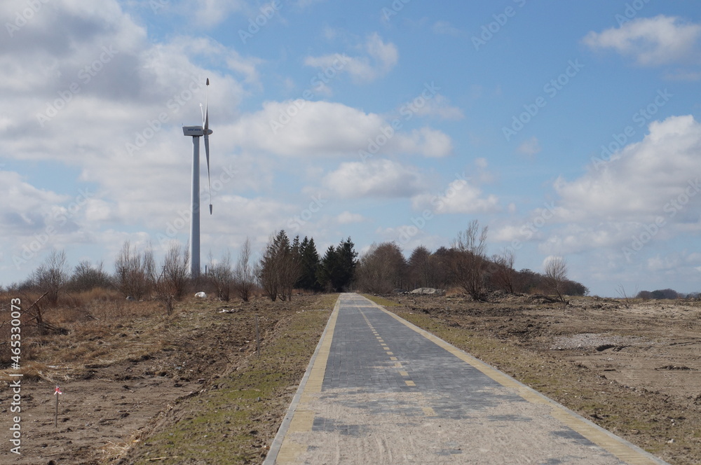 Construction of a bicycle lane. Bicycle lane along the sea. Unfinished pedestrian road. New bicycle lane made of sidewalk tiles. Construction of a bicycle lane. Bicycle lane along the sea. Unfinished pedestrian road. New bicycle lane made of sidewalk tiles.