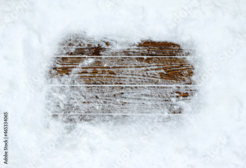 Winter snow background with old planks