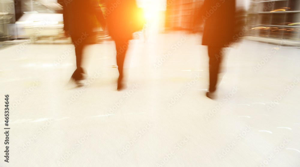 Blur motion of businesspeople walking together.