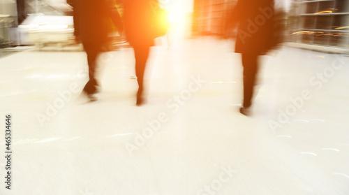 Blur motion of businesspeople walking together.