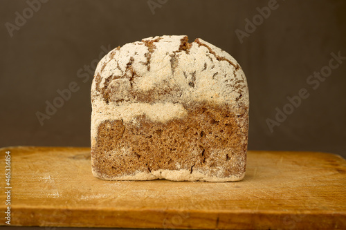 Piece of rye bread on a wooden board