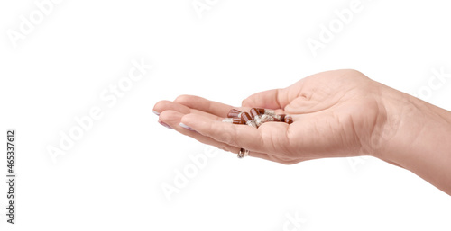 Hand with pills. Female hand with vitamins.