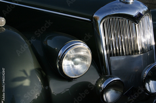 Beautiful close up of old and vintage shiny classic car 