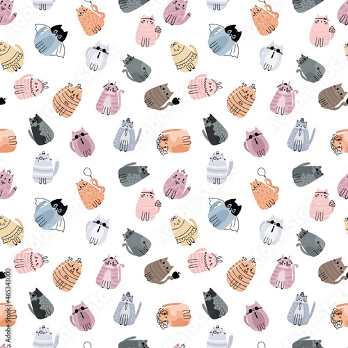 Cute seamless pattern with stylized cartoon cats. Adorable doodle characters. Design for cloth, textile, paper