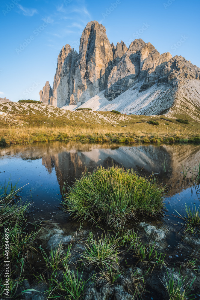 Famous Tre Cime di Lavaredo reflected in small pond, Dolomites Alps Mountains, Italy, Europe. Tre Cime mount in Dolomites