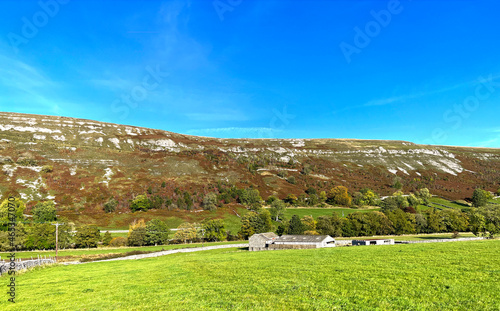 Yorkshire Dales autumn landscape, looking toward the pretty village of, Hawkswick, Skipton, UK photo