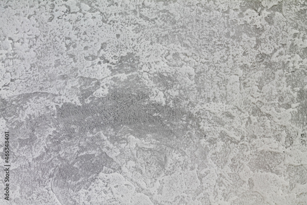 Gray-white background with a gray accent on the edges. The texture of decorative plaster. Gray-white background with a gray accent on the edges. The texture of decorative plaster.