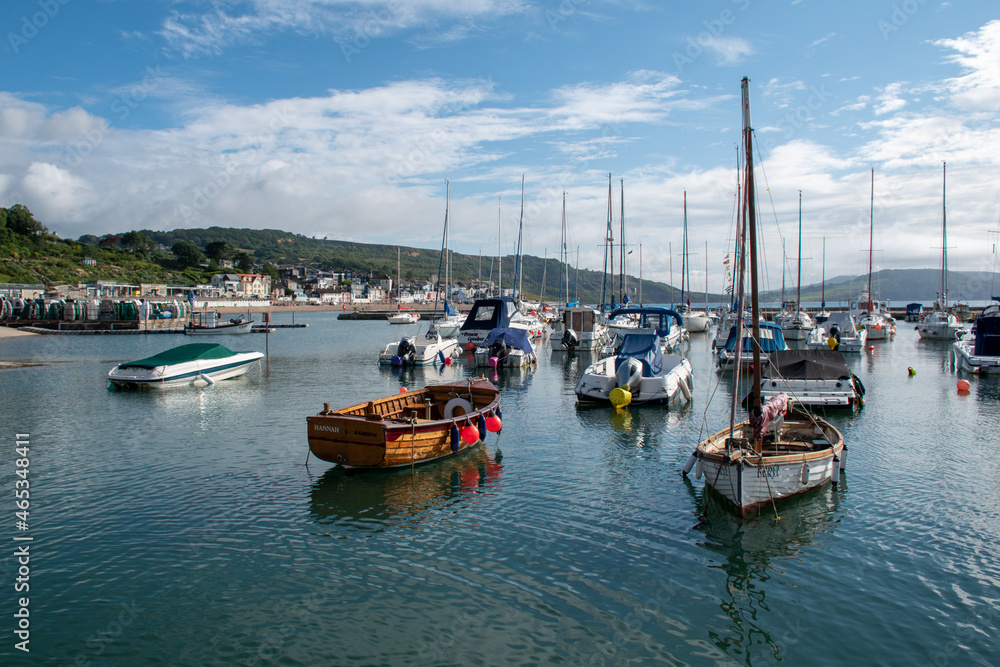 Boats in the harbour at Lyme Regis in Dorset, UK.