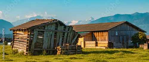 Beautiful alpine summer view with a wooden hut and the famous Hohe Tauern mountains in the background near Leogang, Salzburg, Austria © Martin Erdniss
