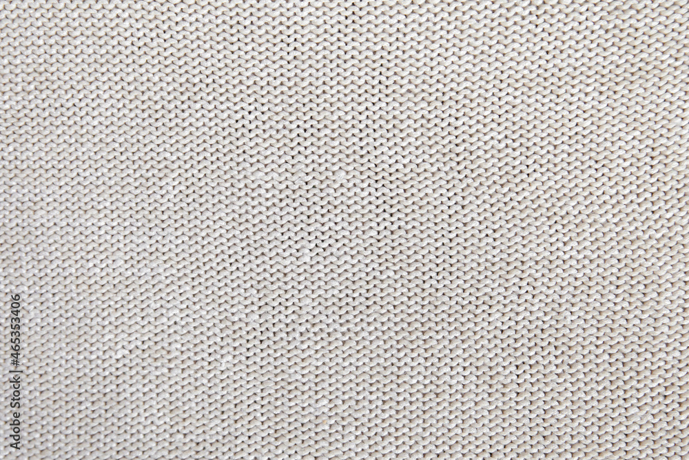 Real grey knitted fabric made of heathered yarn textured background