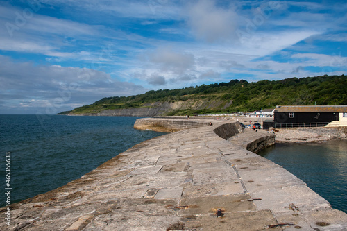 The Cobb harbour, coastal landmark in the seaside town of Lyme Regis, in west Dorset, UK