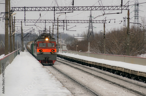 Locomotive of the train in the winter. Transport concept.