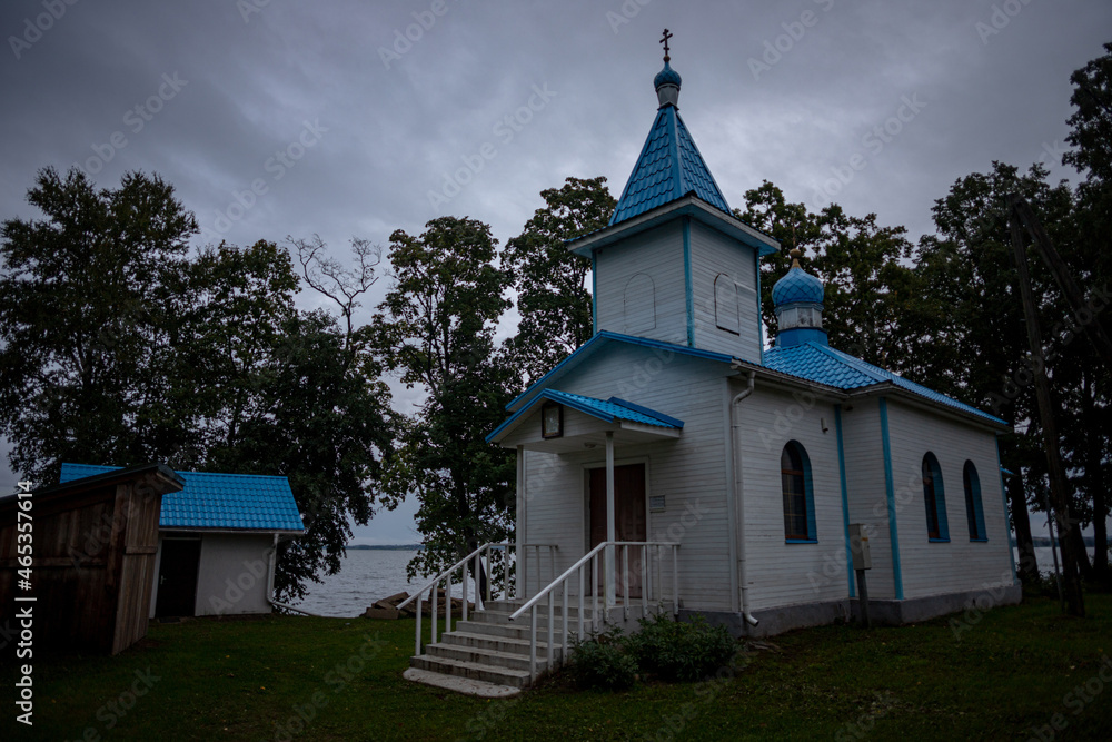 white orthodoxal church with blue roof near Latvia biggest lake Razna white orthodoxal church with blue roof near Latvia biggest lake Razna