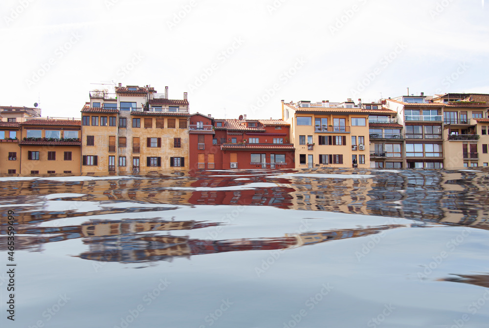 Mediterranean square with village houses in floodwater. Road with overflown water. Floods and flooding the streets. Natural disaster. Manipulated image.