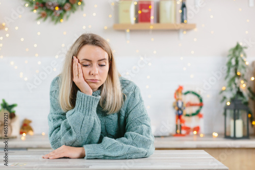 A young beautiful woman was left alone at home for the New Year and Christmas holidays