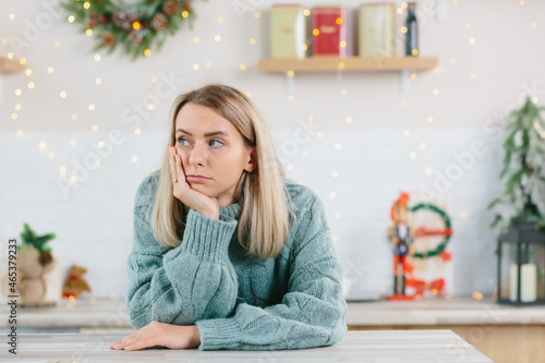Photography A young beautiful woman was left alone at home for the New Year and Christmas ho