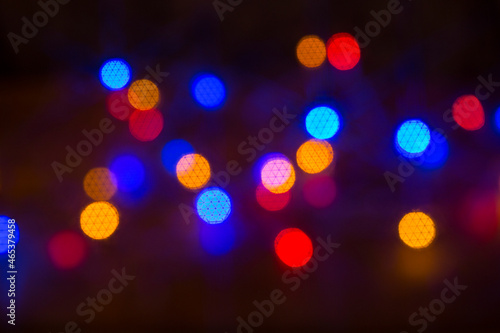 Abstract background with fantasy bokeh texture blue, green, neon color. Fashionable Christmas background.