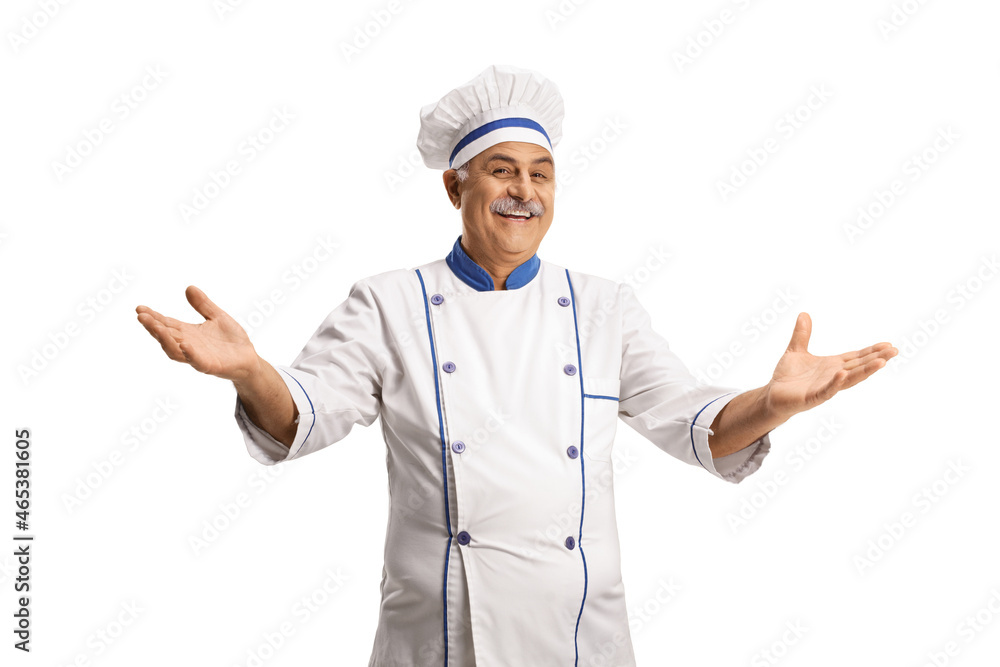 Cheerful mature cook smiling and gesturing with hands Cheerful mature cook smiling and gesturing with hands