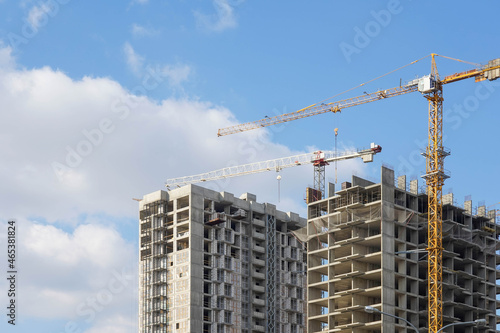 Photo of the construction of a multi-storey buildings and houses