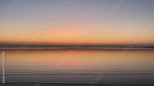 Peaceful, reflective dawn over Dublin Bay, Ireland