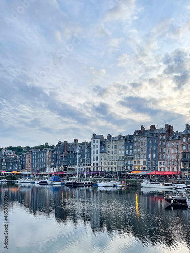 Honfleur harbour in Normandy, France. Color houses and their reflection in the river
