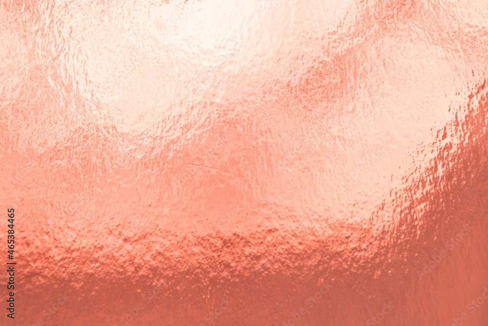 Full frame pink gold background, texture. Gold foil background with light reflections. Beautiful transition of shades. Full frame pink gold background, texture. Gold foil background with light reflections. Beautiful transition of shades.
